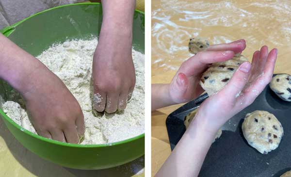 A child's hands making hot cross buns