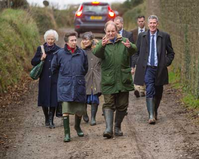 HRH The Princess Royal walking with Michael Morpurgo at Farms for City Children Nethercott House