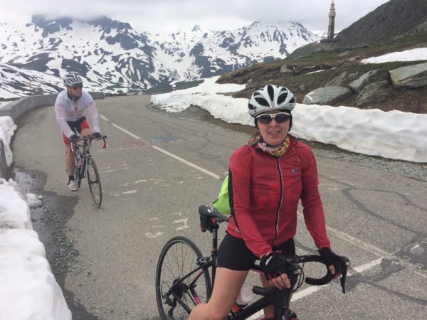 Jackie and her son Tom in the Alps on bikes