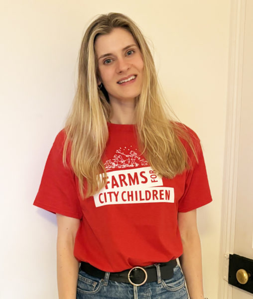Katy Emerson wearing a Farms for City Children tshirt