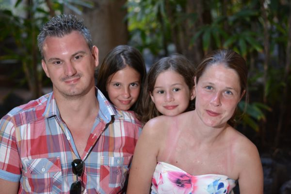 family shot David, Caitlin, Leah and Sally smiling at the camera